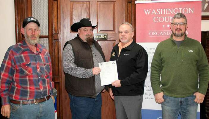 THANK A FARMER WEEK PROCLAIMED - Washington County Commission has proclaimed the week of February 28 - March 6, 2021 as “Thank A Farmer Week” in conjunction with Washington County Farm Bureau. From left are, 2nd District Commissioner Cody Brinley, County Farm Bureau President Jim Reed, Presiding Commissioner Dave Sansegraw presenting the Proclamation and 1st District Commissioner Doug Short. The ‘Thank A Farmer Week’ celebrates the farmers across the country that put food on the tables of Americans.