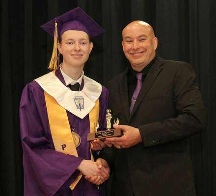 Mr. Tyler Akers, left, was presented the Valedictorian trophy for the Senior Class of Potosi R-3 High School by Principal Matt Bradley