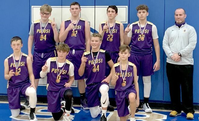 JEMS BOYS 8TH GRADE WIN HILLSBORO TOURNEY – The John A. Evans Middle School 8th Grade boys basketball team took first after defeating Windsor, DeSoto and Hillsboro this past week. The Trojan Boys Team includes, kneeling, from left, #12 Liam DeGonia, #11 Jake Phares, #24 Carter Whitley and #5 Ayden Ricketts; standing, #34 Mike Chavosky, #32 Ean Eaton, #22 Samuel Rhodes, #20 Edward Sansegraw and Coach Kurt Davis. The Trojans won handily over all three opponents to take the Championship.