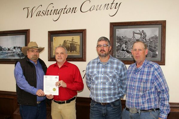 WASHINGTON COUNTY COMMISSION PROCLAIMS ‘THANK A FARMER WEEK’ – At left, Washington County Farm Bureau President Jim Reed receives a Proclamation from the Washington County Commission recognizing the importance of agriculture and the value it offers in Washington County. Presenting the Proclamation, from left, next to Reed, is Presiding Commissioner Dave Sansegraw, 1st District Commissioner Doug Short and 2nd District Commissioner Cody Brinley. The Commission is pleased to recognize the farmers and agricultural businesses in the County and the important role they play in the local economy. A worthwhile note is that both Commissioners Short and Brinley are both in the farming and ag business themselves. Thank a farmer this week when you sit down to a meal, have a snack or get dressed to go out! The Proclamation was delivered at the Monday morning meeting of the County Commission at the Courthouse on Monday, March 6th, 2023.